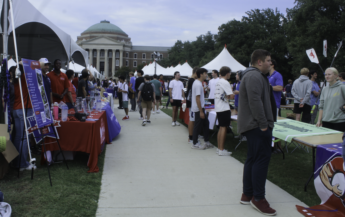 SMU students walking through the different clubs at SMU's night at the club event on Dallas Lawn in Dallas, Texas.