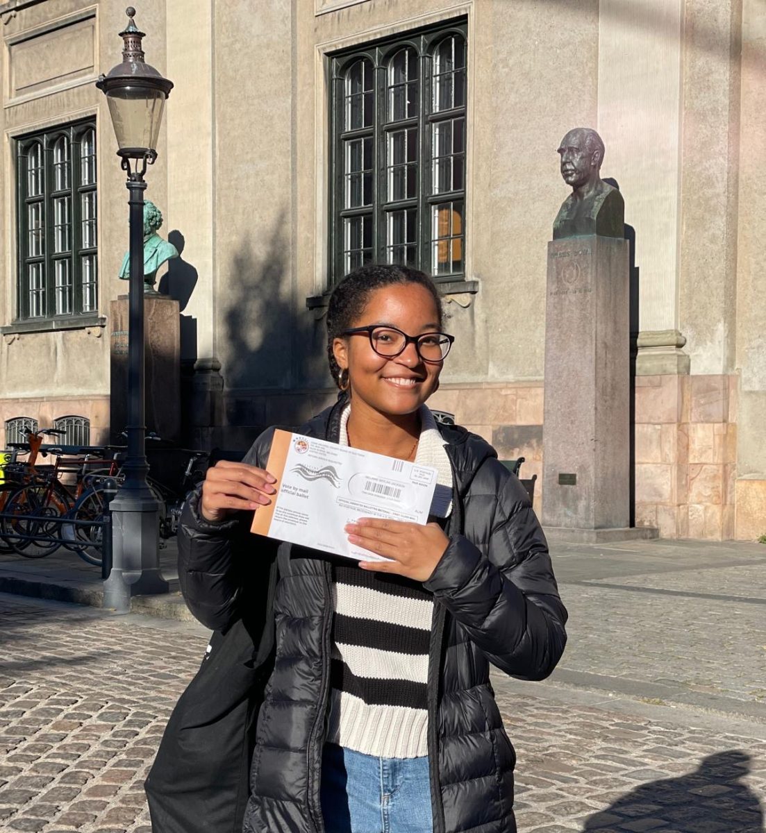 Melanie Jackson, an SMU Junior, in Copenhagen, Denmark with her absentee ballot.