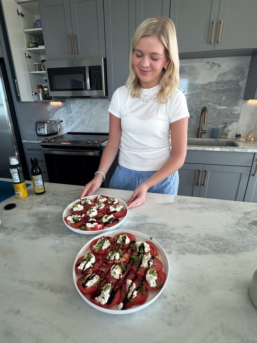 SMU junior Emmy Kay Jensen prepares caprese salads, one of the recipes she's trying out now that she has her own apartment.