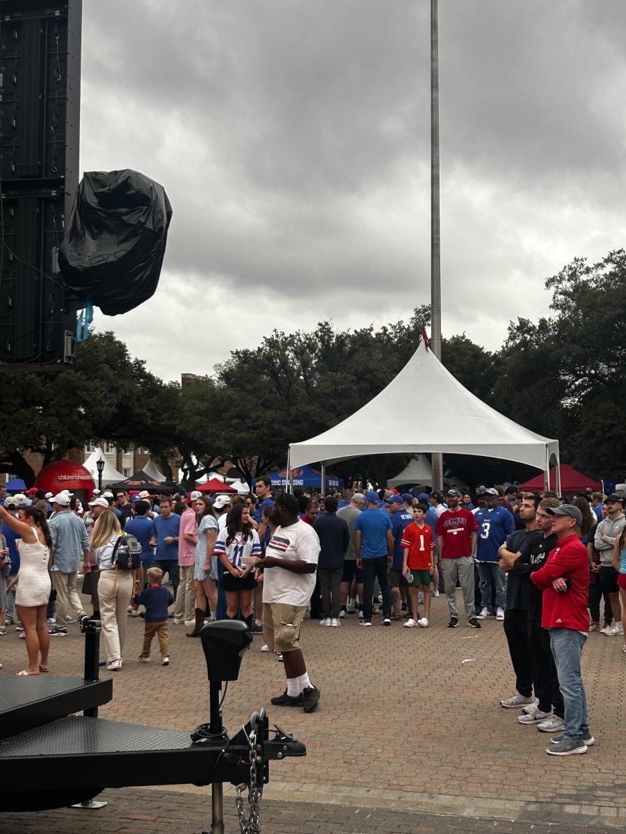 SMU and Pitt fans standing and watching football on the Boulevard, Dallas Texas, Saturday, November 2, 2024 (©2024/Mikaila Neverson).