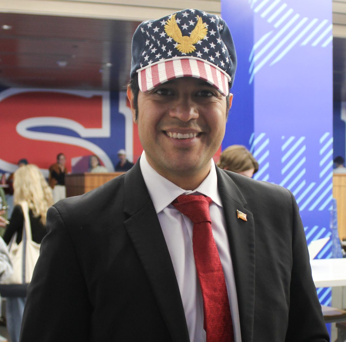 Voter Ernesto Valles showed up to vote at Hughes Trigg wearing an American Flag hat on Election Day in Dallas on November 5, 2024.