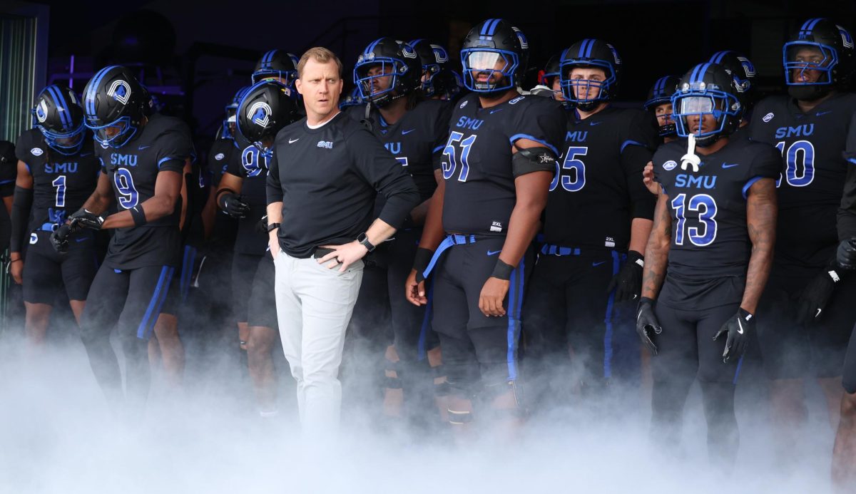 The SMU football team lines up with head coach Rhett Lashlee as they prepare to storm the football field in Dallas, Texas, on November 16, 2024. 