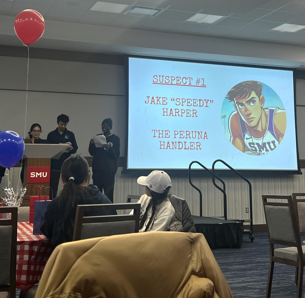 Directors of Southern Methodist University's Housing Unification Board stand at the front of the Hughes-Trigg Ballroom to act out scenes and describe suspects from the murdery mystery to participants. 