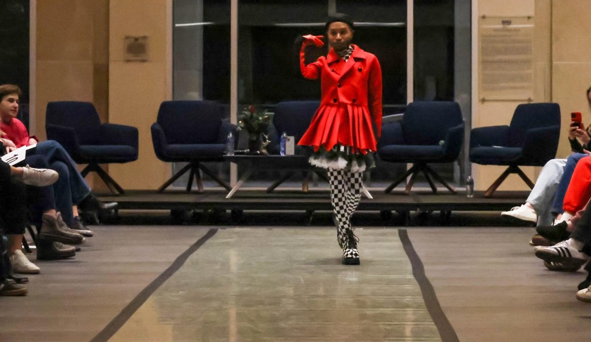 Members of the House Unbothered Cartier strut down the runway, showing attendees the essentials of ballroom culture. 