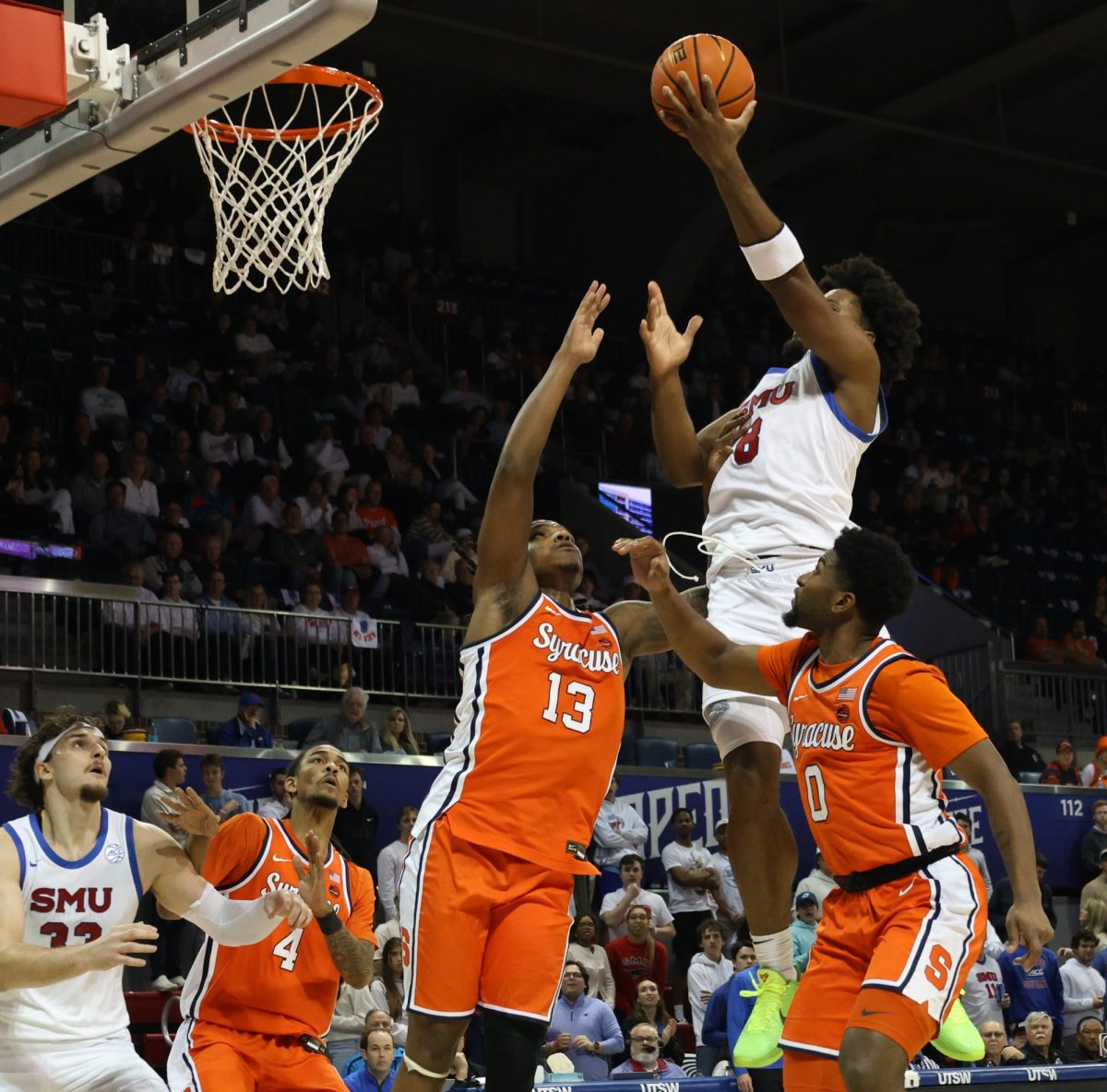 Kario Oquendo jumps to make the basket in SMU’s game against Syracuse. 