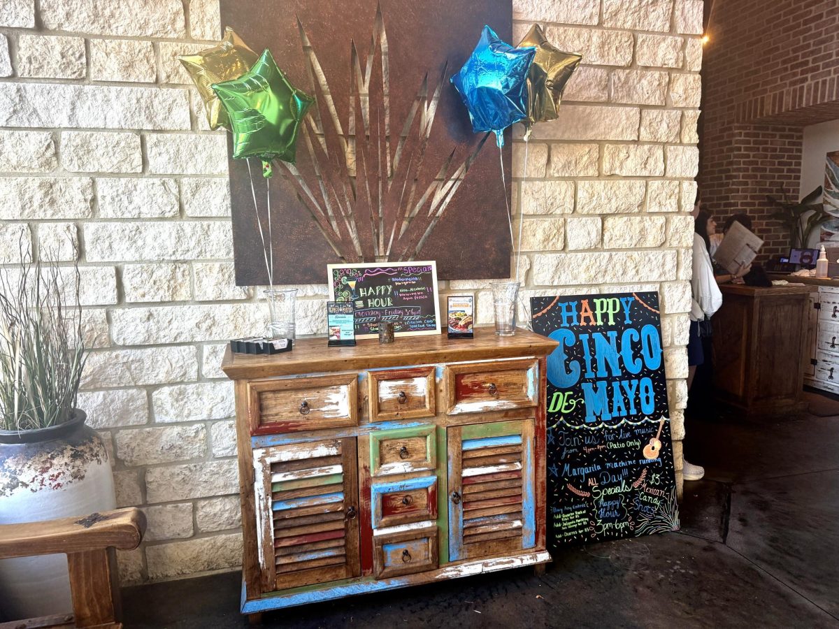 A Cinco de Mayo specials board is advertised at a Mexican restaurant. 