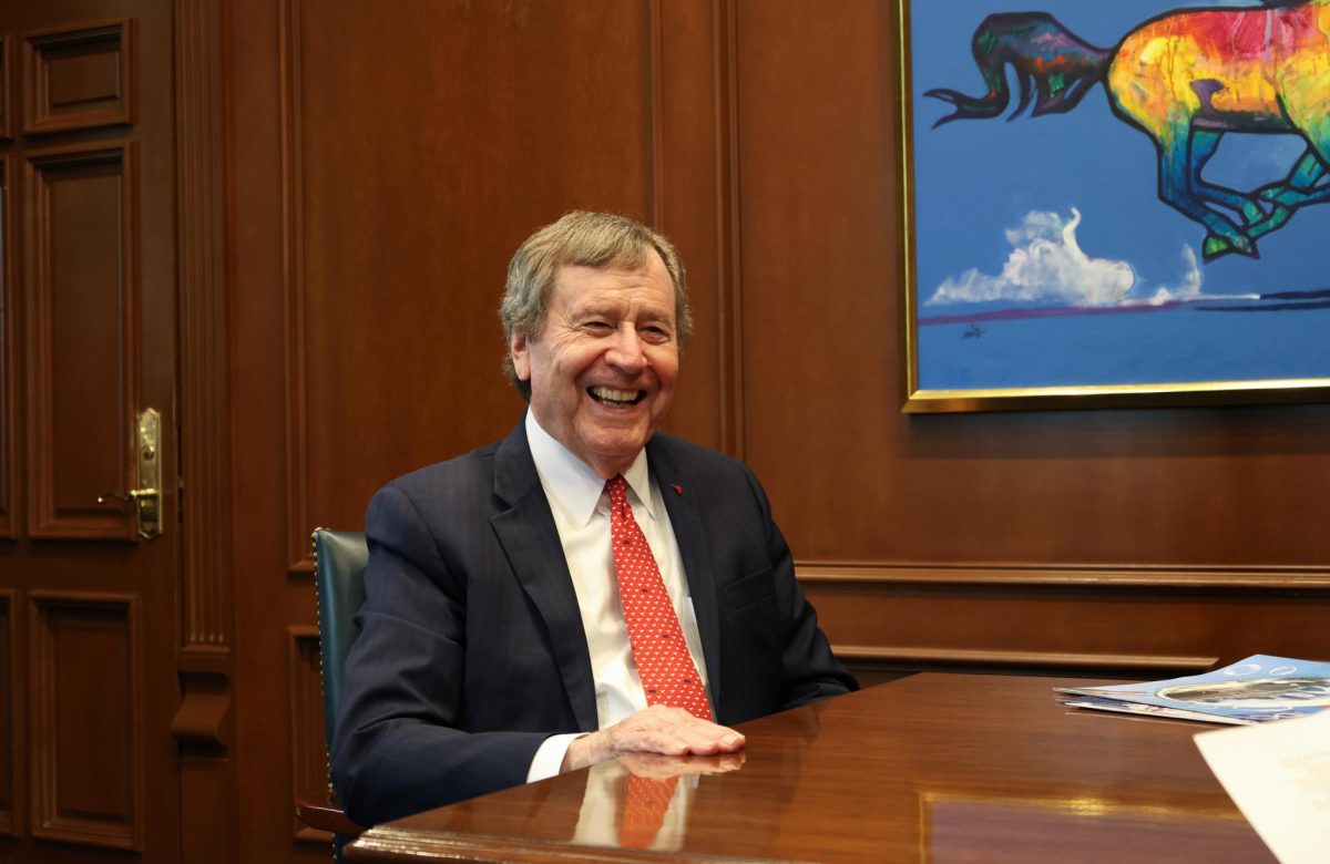 Dr. Turner laughs during a Q&A interview with The Daily Campus about hsi tenure as SMU's president in his office.
