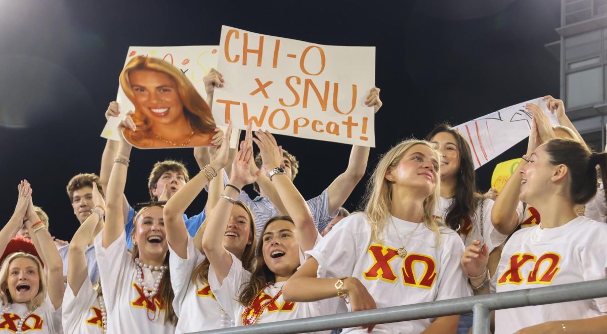 Members of Chi Omega and Sigma Nu cheer in support of their homecoming royalty candidates, Kaitlyn Kuchar and Hayden Horn, at Rock the Vote in Dallas, Texas, on Oct. 27, 2025. 