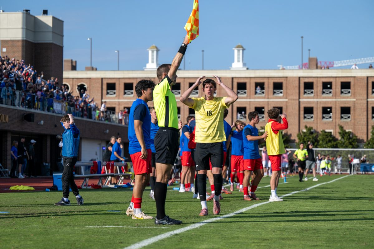 SMU players react to goal being disallowed after the referee claimed offsides

