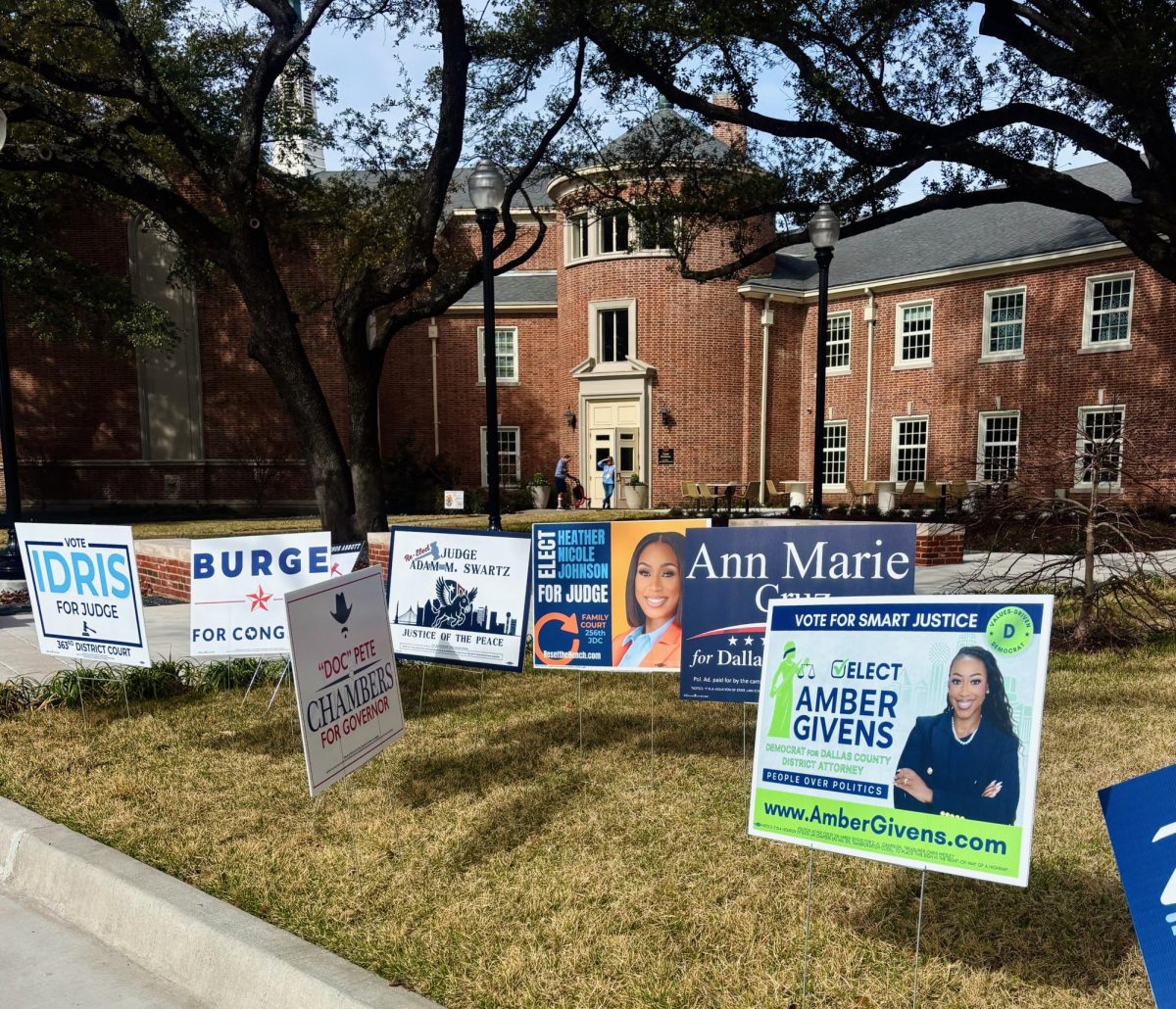 Candidate campaign signs line the lawn of University Park United Methodist Church, a polling location for the Texas primary election, less than 10 minutes from Southern Methodist University’s campus.