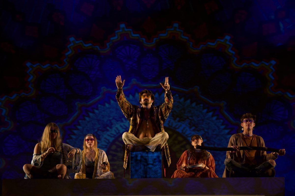 The “Wellness Guru” instructs Papageno and Tamino on their first “wellness retreat” in Act I of “The Magic Flute 2.0.”