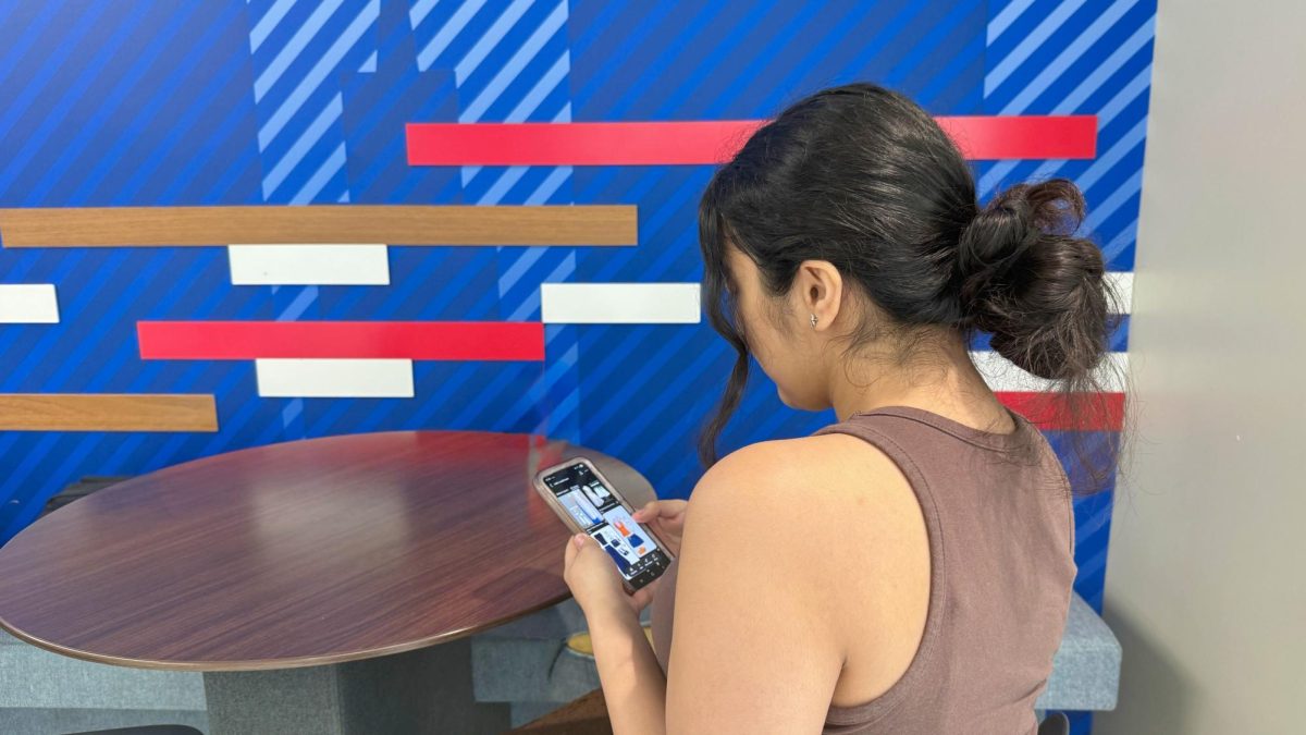 An SMU student browses social media for outfit inspiration, highlighting the growing role of digital trends in everyday fashion.